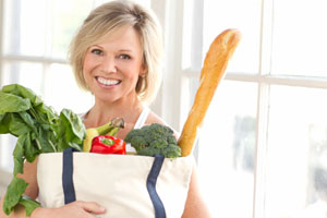 Alyson Richards with a bag of healthy Groceries